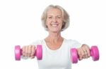 Happy Aged Woman Exercising Stock Photo