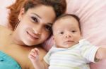 Happy Latin Mother With Her Baby Stock Photo