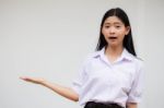 Portrait Of Thai High School Student Uniform Beautiful Girl Show Hand Stock Photo