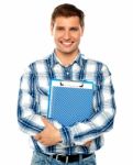 Young Man Holding Clipboard Stock Photo