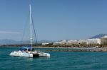 Catamaran Entering The Harbour In Marbella Stock Photo