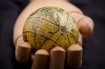 Global In Wooden Hand Stock Photo