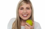 Health Conscious Girl Holding Green Apple Stock Photo