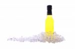 Liquor Bottle And Ice Cracked On White Background Stock Photo