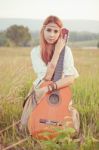 Hippie Girl Playing Guitar On Grass Stock Photo