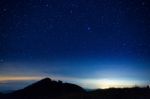 Night Sky With Star On Top Of Mountain Stock Photo