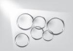 Abstract  Background - Silver Circles Behind White Wall Design Stock Photo