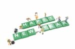 Miniature Worker Team Building Word Happy New Year On White Background Stock Photo