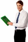 Employee Using Big Green Calculator Stock Photo