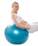 Smiling Lady Leaning On Gym Ball Stock Photo