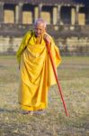 An Unidentified Old Buddhist Female Monk Dressed In Orange Toga Stock Photo