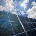 Solar Panels On Blue Sky Background Stock Photo