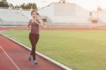 Women Runners Sprinting Outdoors. Healthy Lifestyle And Sport Co Stock Photo