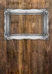 Old Silver Picture Frame On Wooden Background Stock Photo