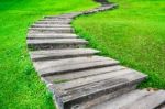 Nature Background With Old Stone Walkway In The Green Grass Stock Photo