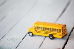 Minimal School Bus On Wooden Panel Stock Photo