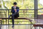 Young Businessman Looking At Report Paper Stock Photo