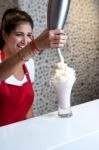 Woman Preparing Thick Shake Stock Photo