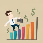 The Man Growth In Business Chart Stock Photo