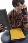 Student With Pencil And Books Stock Photo