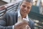 Good News! Men Reading Sms On Smartphone In Business Building Stock Photo