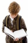 Front View Of Schoolchild Reading Stock Photo