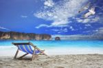 Wood Chairs Beach At Sea Side With Beautiful Sea Gull Birds Flyi Stock Photo