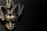 Masks And Feathers Of Venice Carnival On Black Background Stock Photo