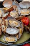 Fresh Clams On An Iron Skillet Stock Photo