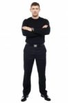 Young Male With Crossed Arms Stock Photo