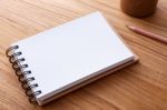 Spiral Notebook On Wood Table Stock Photo