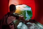 Camping Man In Camper Tent Looking To Beautiful Natural Water Falls Scenic Use For People Vacation Traveling To Destination Stock Photo