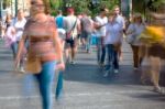 Blurry People Walking In The Street Stock Photo