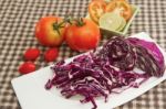 Red Cabbage Slice On White Plate With Fresh Vegetable Stock Photo