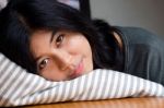 Young Cute Girl Resting On Soft Pillow Stock Photo