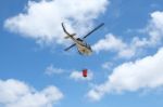 Firefighter Helicopter Flying With Bambi Bucket Stock Photo