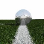 Silver Soccer Ball In Grass Stock Photo