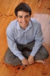 Man Sitting On The Floor Stock Photo