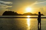 Girls On The Beach During Sunrise Stock Photo