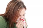 Woman With Cold Blowing Nose Stock Photo