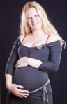 Pregnant Woman Holding Tummy Stock Photo