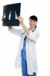 Young Surgeon Holding X-ray Sheet Of A Patient Stock Photo