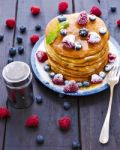 Pancakes With Honey And Berries Stock Photo