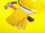 Hard Hat Hammer And Leather Gloves Stock Photo