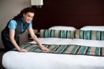 Housekeeping Staff Arranging Room Stock Photo