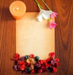 Old Paper With Flowers And Candle Stock Photo