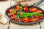 Baked Cherry Tomatoes With Basil And Thyme Stock Photo