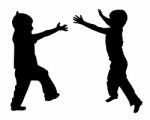 Silhouettes Of Two Little Boys Stock Photo