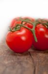 Fresh Cherry Tomatoes On A Cluster Stock Photo