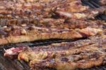 Traditional Meat Grilled On The Grill In The Argentine Countryside Stock Photo